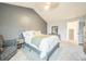 Bedroom with neutral tones, large bed, dresser, and chair, offering a calming retreat at 1470 S Quebec Way # 8, Denver, CO 80231