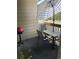 This patio has a table with umbrella, chairs and grill at 1470 S Quebec Way # 8, Denver, CO 80231