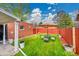 Beautiful backyard with a green lawn, an outdoor dining set, and privacy fence at 3070 Colorado Blvd, Denver, CO 80207