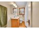 Bright bathroom with modern fixtures, hardwood floors, window, and a neutral color palette at 3070 Colorado Blvd, Denver, CO 80207