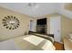 Bedroom with a modern ceiling fan, decorative wall mirror, and a flat screen tv at 3070 Colorado Blvd, Denver, CO 80207