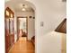 Charming hallway with hardwood floors and an arched entrance leading to other rooms at 3070 Colorado Blvd, Denver, CO 80207