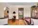 Elegant living room featuring a decorative door and seamlessly connected layout for entertaining at 3070 Colorado Blvd, Denver, CO 80207