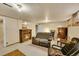 A cozy living room has an ornate fireplace and neutral-colored furniture at 3070 Colorado Blvd, Denver, CO 80207