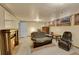 Well-lit living room featuring a fireplace, comfortable seating, and windows at 3070 Colorado Blvd, Denver, CO 80207