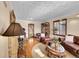 Spacious living room showcasing hardwood floors, a fireplace, and a seamless flow for gatherings at 3070 Colorado Blvd, Denver, CO 80207
