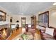 Spacious living room featuring a fireplace, hardwood floors, and lots of natural light at 3070 Colorado Blvd, Denver, CO 80207