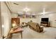 Cozy living room with wood-paneled walls and recessed windows at 3070 Colorado Blvd, Denver, CO 80207