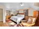 Spacious main bedroom featuring hardwood floors, neutral walls, and bright, natural light at 3070 Colorado Blvd, Denver, CO 80207