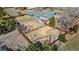 Aerial view of the home with backyard playground, shed, and lush green surroundings at 7400 W Quincy Ave, Littleton, CO 80123