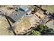 Aerial view of the backyard showcasing a playground, a patio, and a spacious, landscaped yard at 7400 W Quincy Ave, Littleton, CO 80123