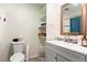 Clean bathroom featuring a modern vanity, linen closet, and a shower-tub combination at 7400 W Quincy Ave, Littleton, CO 80123