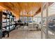 Bright office with a wood ceiling, desk, storage, and natural light from windows at 7400 W Quincy Ave, Littleton, CO 80123