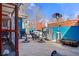 Outdoor patio space with a grill, outdoor seating, and blue painted walls at 7400 W Quincy Ave, Littleton, CO 80123