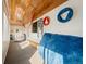 Bright sunroom featuring a wood ceiling, large windows, and fun recreation space at 7400 W Quincy Ave, Littleton, CO 80123