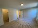 Bright bedroom with carpet flooring, spacious closet, and access to bathroom at 2160 S Vaughn Way # 204C, Aurora, CO 80014