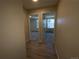 Hallway with two bedrooms and updated flooring at 2160 S Vaughn Way # 204C, Aurora, CO 80014