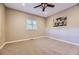 Spacious bedroom with a ceiling fan and large window at 7456 S Moore Ct, Littleton, CO 80127