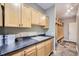 Laundry room with built-in cabinets and shelving at 7456 S Moore Ct, Littleton, CO 80127