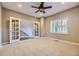 Home office with french doors and ceiling fan at 7456 S Moore Ct, Littleton, CO 80127