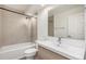 Modern bathroom featuring tiled walls, vanity with sink, and a shower-over-tub setup at 7040 E Girard Ave # 104, Denver, CO 80224