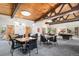 Well-lit game room featuring tables and chairs, with an adjacent pool table area at 7040 E Girard Ave # 104, Denver, CO 80224