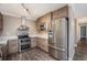 Well-equipped kitchen featuring stainless steel appliances and stylish wood cabinetry at 7040 E Girard Ave # 104, Denver, CO 80224