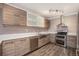 Stylish kitchen with stainless steel appliances, modern cabinets, and ample counter space at 7040 E Girard Ave # 104, Denver, CO 80224