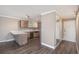 Neutral living room featuring breakfast bar with modern cabinets and stainless appliances in view at 7040 E Girard Ave # 104, Denver, CO 80224