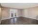 Open living room with doors to patio at 7040 E Girard Ave # 104, Denver, CO 80224
