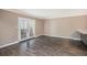 Bright living room featuring French doors with balcony access at 7040 E Girard Ave # 104, Denver, CO 80224
