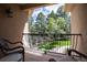 Relax on this balcony with wrought iron railing and enjoy the green scenery at 5170 Pinyon Jay Rd, Parker, CO 80134