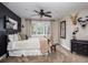 Tranquil bedroom with large windows and stylish black accents at 5170 Pinyon Jay Rd, Parker, CO 80134