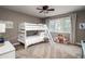 Well-lit bedroom with a bunk bed and an exterior view at 5170 Pinyon Jay Rd, Parker, CO 80134