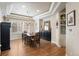 Elegant dining room with tray ceiling, hardwood floors, and stylish furnishings at 5170 Pinyon Jay Rd, Parker, CO 80134