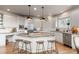 Modern kitchen with granite countertops, stainless steel appliances, and a large island at 5170 Pinyon Jay Rd, Parker, CO 80134