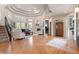 Bright living room with hardwood flooring, fireplace, and staircase access at 5170 Pinyon Jay Rd, Parker, CO 80134