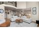 Open-concept living area connects the kitchen to the living room and balcony above at 5170 Pinyon Jay Rd, Parker, CO 80134