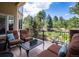 Outdoor patio features cozy seating and a beautiful view of the landscaped backyard at 5170 Pinyon Jay Rd, Parker, CO 80134