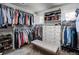 Organized walk-in closet with ample shelving, drawers, and storage space at 5170 Pinyon Jay Rd, Parker, CO 80134
