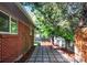 Inviting backyard with a stone-tiled patio and lush greenery, great for relaxing and entertaining at 4585 S Elati St, Englewood, CO 80110