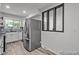 Bright kitchen featuring stainless steel appliances, white cabinets, and a modern backsplash, creating a sleek and functional space at 4585 S Elati St, Englewood, CO 80110