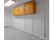 Functional storage space featuring neutral walls, gray flooring, and wood cabinets at 4585 S Elati St, Englewood, CO 80110