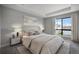 Bedroom with a neutral color scheme, tray ceiling, carpeted floor, and lots of natural light at 2078 S Holly St # 2, Denver, CO 80222