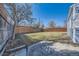 Expansive backyard showcasing a new fence, offering privacy and a large outdoor space at 7100 E 5Th Ave, Denver, CO 80220