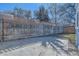 Backyard with a newly built fence, providing privacy, and a concrete patio for outdoor living at 7100 E 5Th Ave, Denver, CO 80220