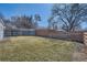 Spacious backyard features a well-maintained lawn and a privacy fence for outdoor enjoyment at 7100 E 5Th Ave, Denver, CO 80220