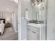 Contemporary bathroom featuring sleek vanity, glass-enclosed shower, and modern fixtures at 7100 E 5Th Ave, Denver, CO 80220
