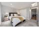 Bright bedroom with a skylight, soft carpet, and neutral colors creating a relaxing atmosphere at 7100 E 5Th Ave, Denver, CO 80220