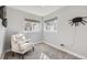 Bedroom with chair, soft carpet, neutral colors, with a window bringing in lots of light at 7100 E 5Th Ave, Denver, CO 80220